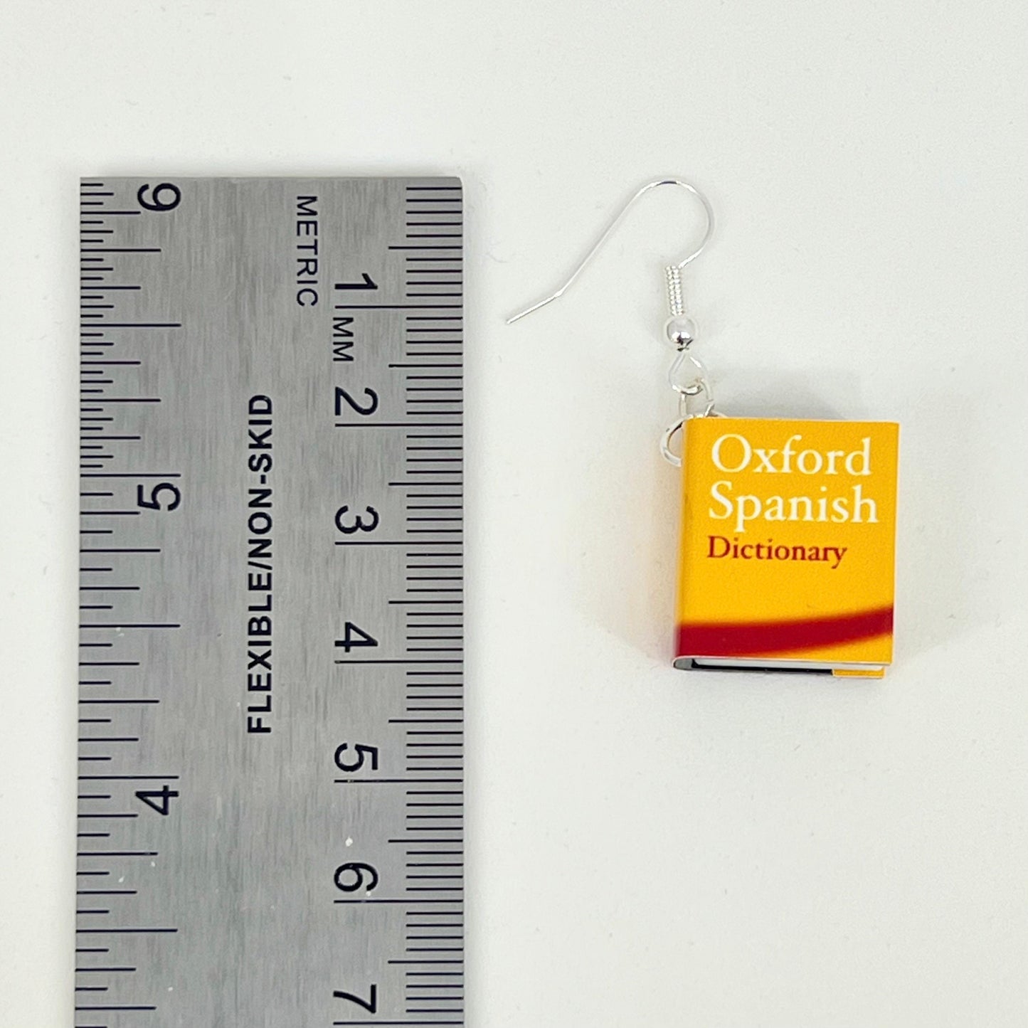 Miniature Spanish dictionary earrings