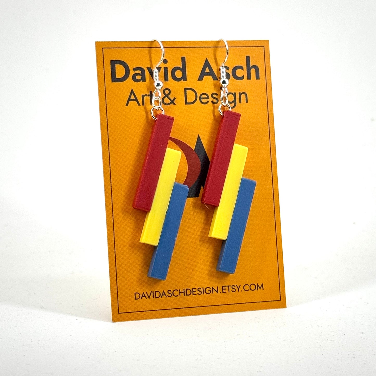 Minimalist geometric tri-colour earrings in red, yellow and blue