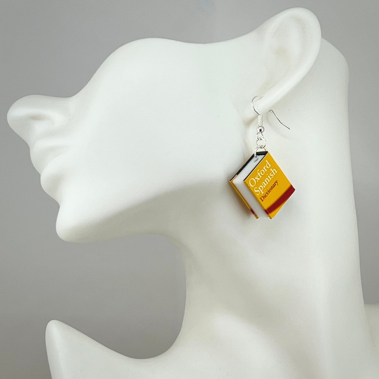 Miniature Spanish dictionary earrings