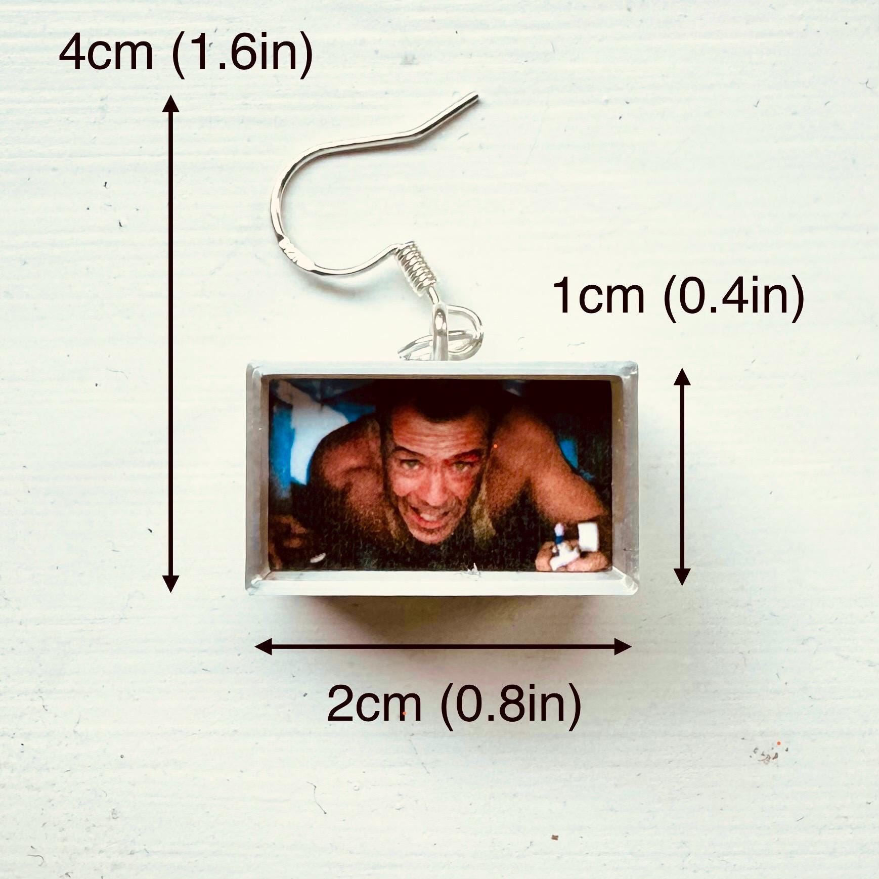 Die Hard John McClane air-duct mini dangle earrings for Christmas action movie fan (pair) by David Asch - Art & Design