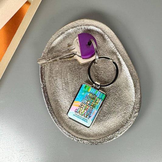Personalised book cover keyring with engraved message