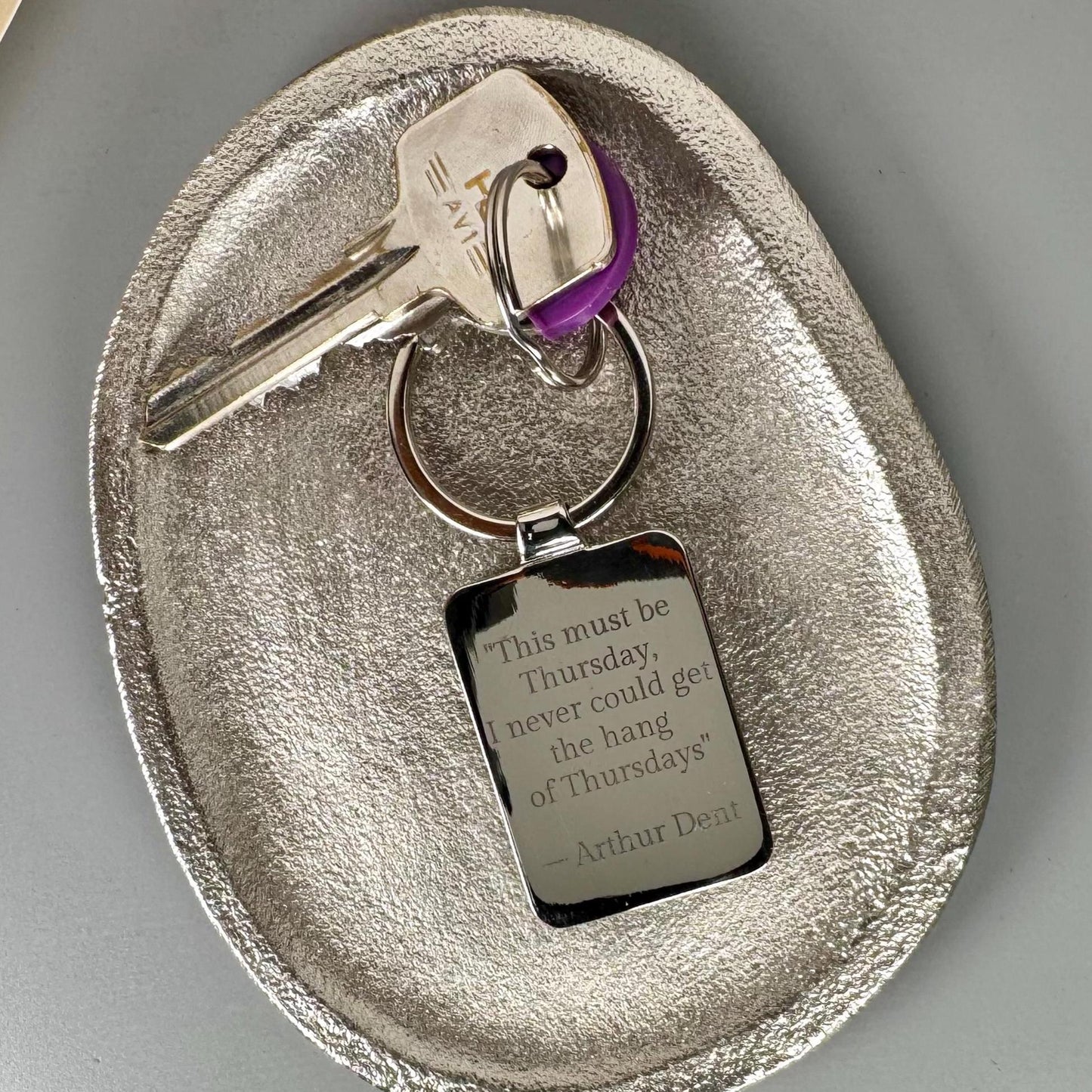 Personalised book cover keyring with engraved message