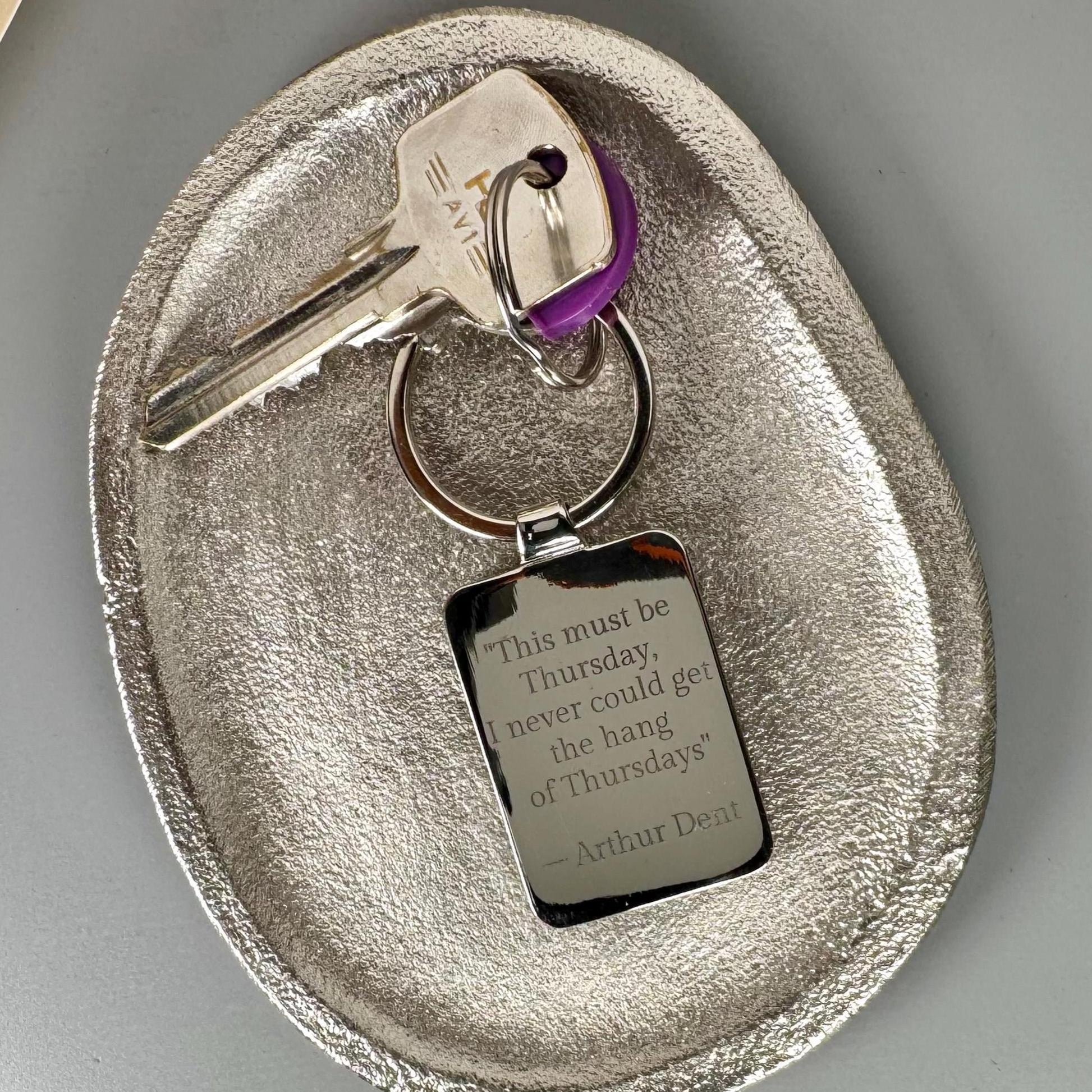 Personalised book cover keyring with engraved message