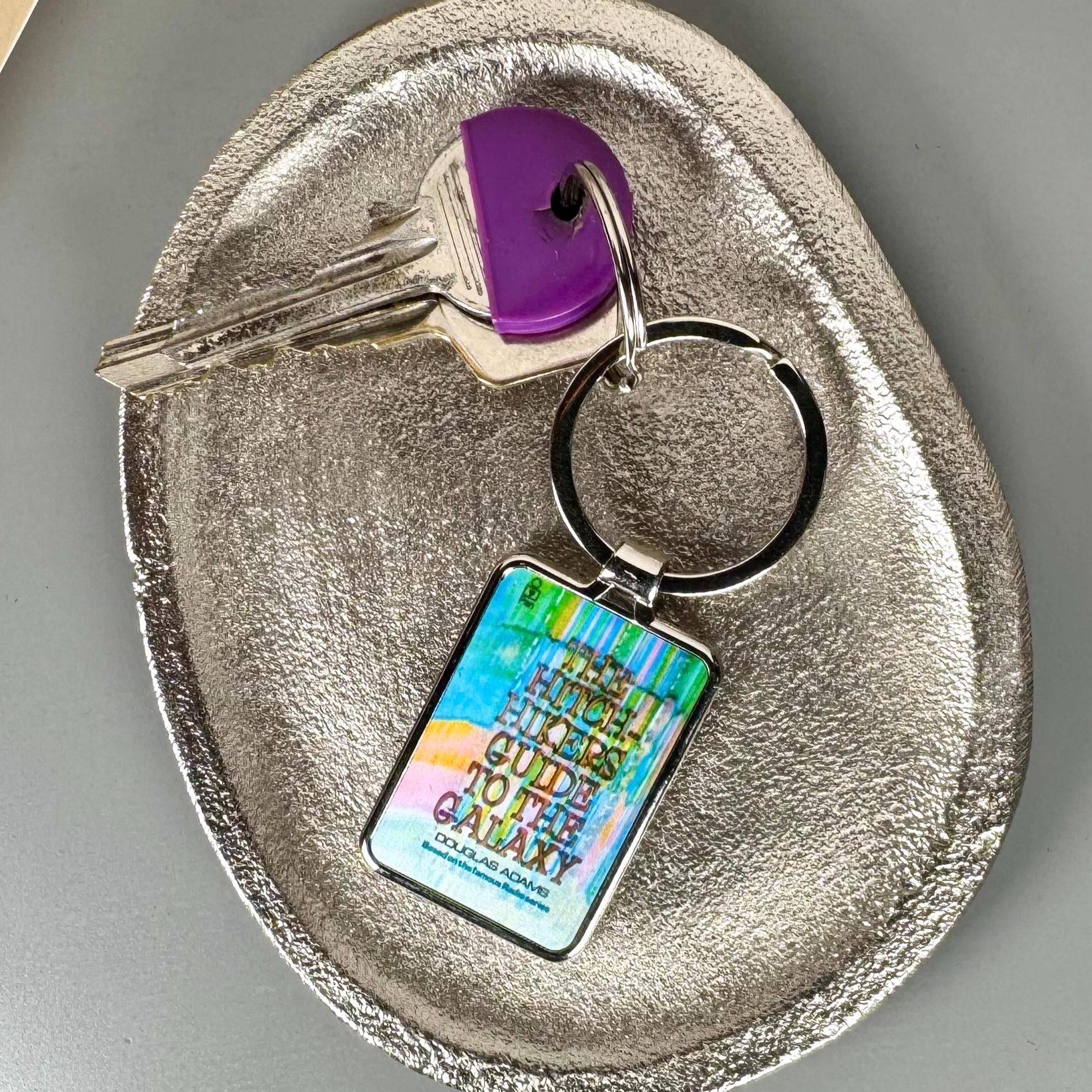 Personalised book cover keyring with engraved message